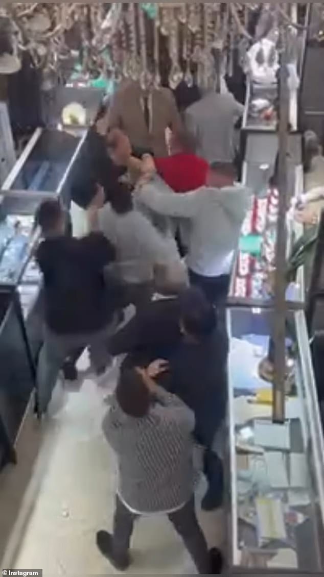 Surveillance footage captured the scuffle between the two owners of the jewelry shops