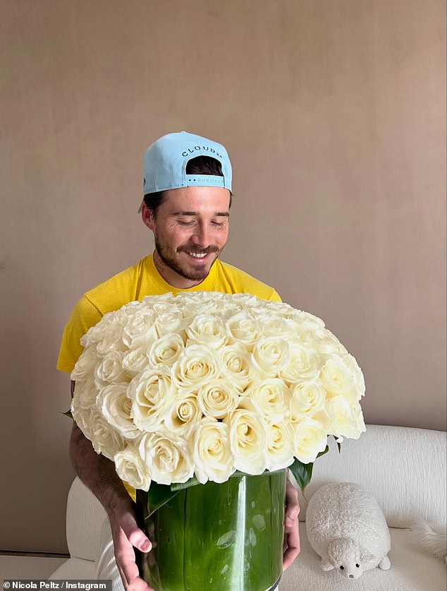 Nicola Peltz has given a glimpse into 'beautiful moments' with her husband Brooklyn Beckham, who appeared to have bought her hundreds of roses for her 31st birthday, as their row with his parents rages on