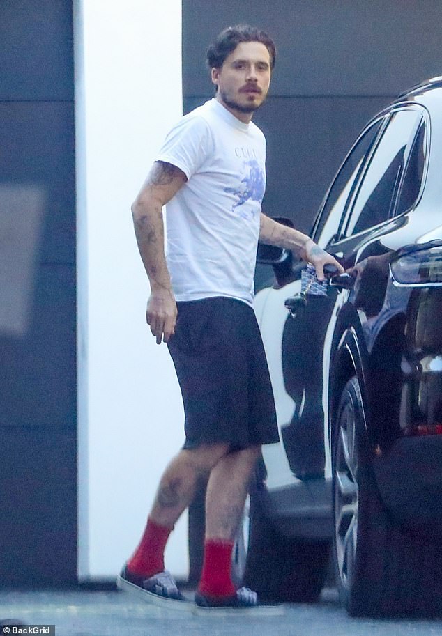 Brooklyn Beckham and his wife Nicola Peltz broke cover on Monday - just after the reason he sent a legal letter to his estranged parents David and Victoria was reportedly revealed