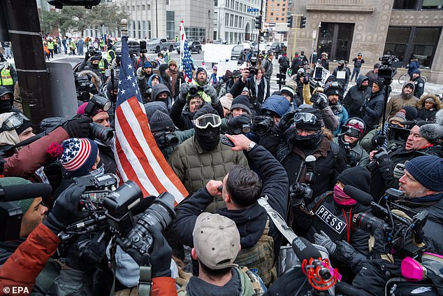 The fatal shooting of mother-of-three Renee Nicole Good by a federal agent in Minnesota sent shockwaves across America, and in many cities, it has sparked the mobilization of anti-ICE boot camps. (Pictured: Anti-ICE protesters clash with police in Minneapolis on Saturday)