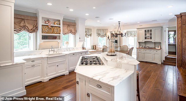 The sprawling property boasted two kitchens, a sunroom, an office, a game room, a formal dining room, an office, and a family room with a bar