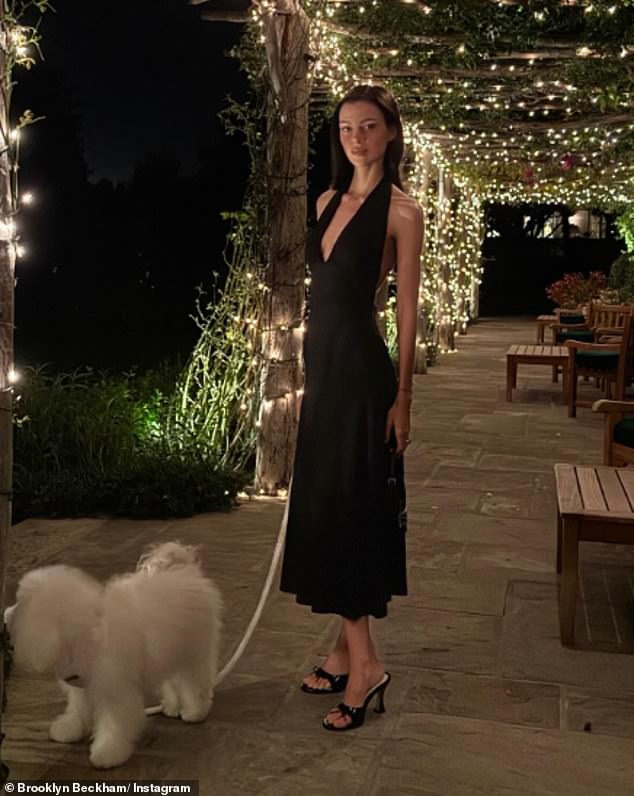 The actress cut a glamorous figure in a black halterneck gown for their fancy meal