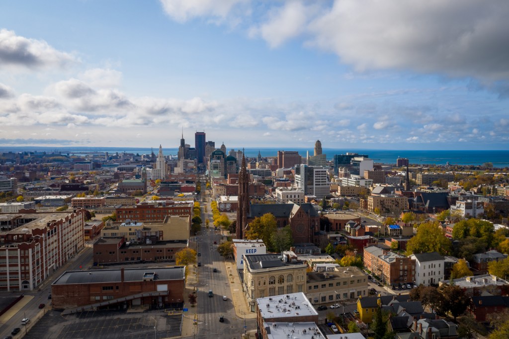 Aerial view of downtown Buffalo, New York during fall with Lake Erie in the background.