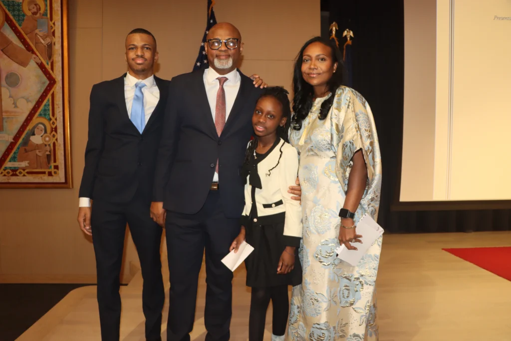 Hon. Chidi Eze alongside his wife and children. Brooklyn Eagle photo by Mario Belluomo