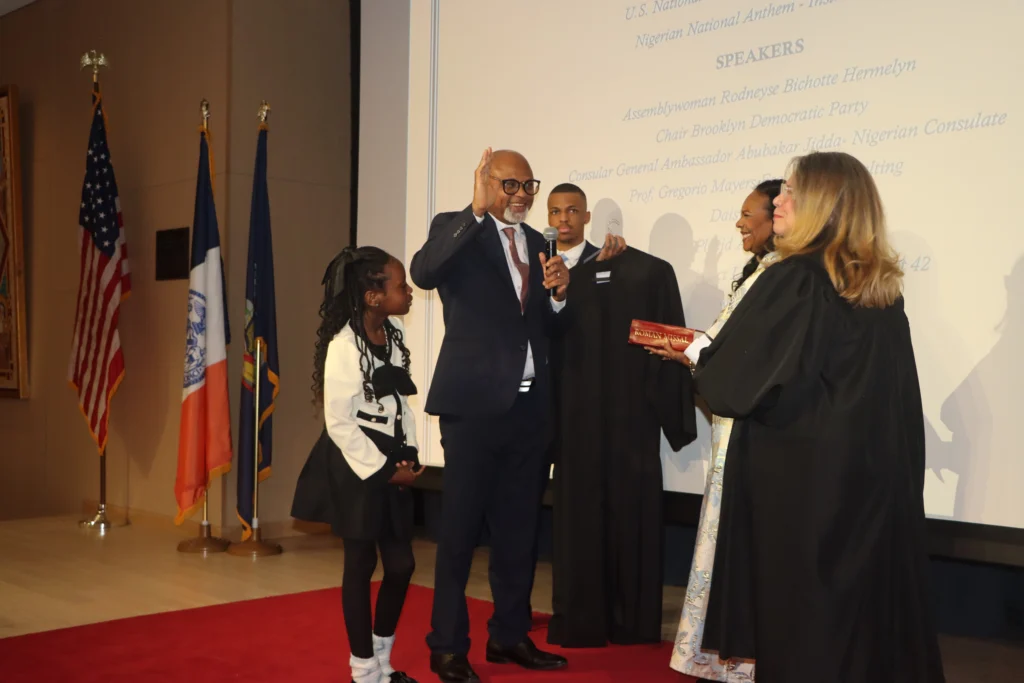Hon. Chidi Eze being sworn in by Carmen Pacheco, supervising judge of the Kings County Civil Court of New York. Brooklyn Eagle photo by Mario Belluomo
