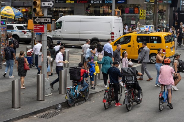 Pedestrians make their way through New York City. (Shutterstock) 