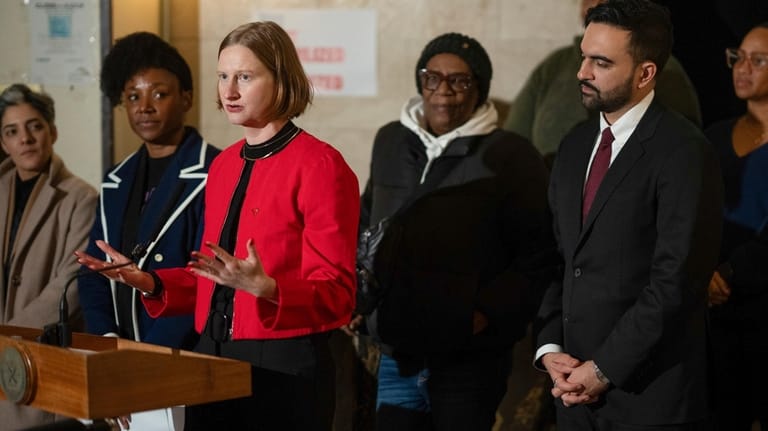 Cea Weaver, left, speaks during a news conference with New...