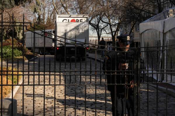 Moving trucks arrive at Gracie Mansion, Monday, Jan. 12, 2026, in New York. (AP Photo/Yuki Iwamura)