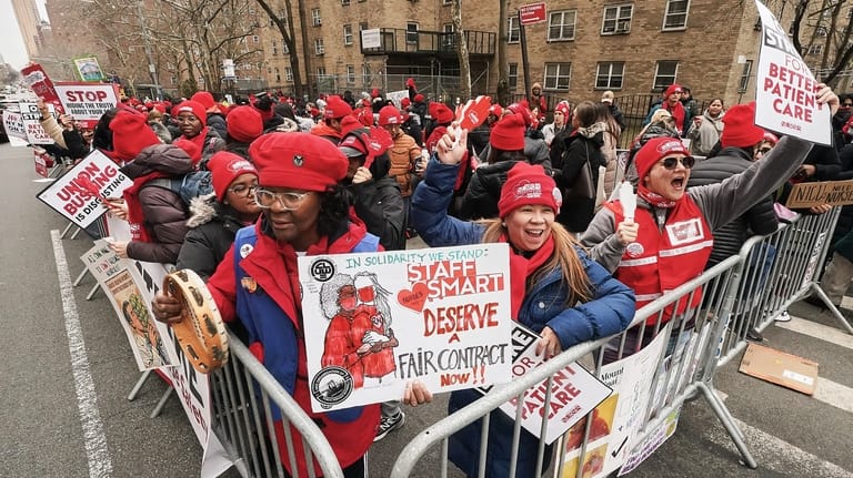 Striking nurses demonstrate outside Mt. Sinai Hospital, in New York,...