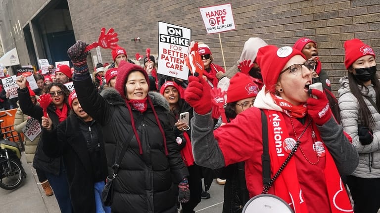 Striking nurses demonstrate outside Mt. Sinai Hospital, in New York,...