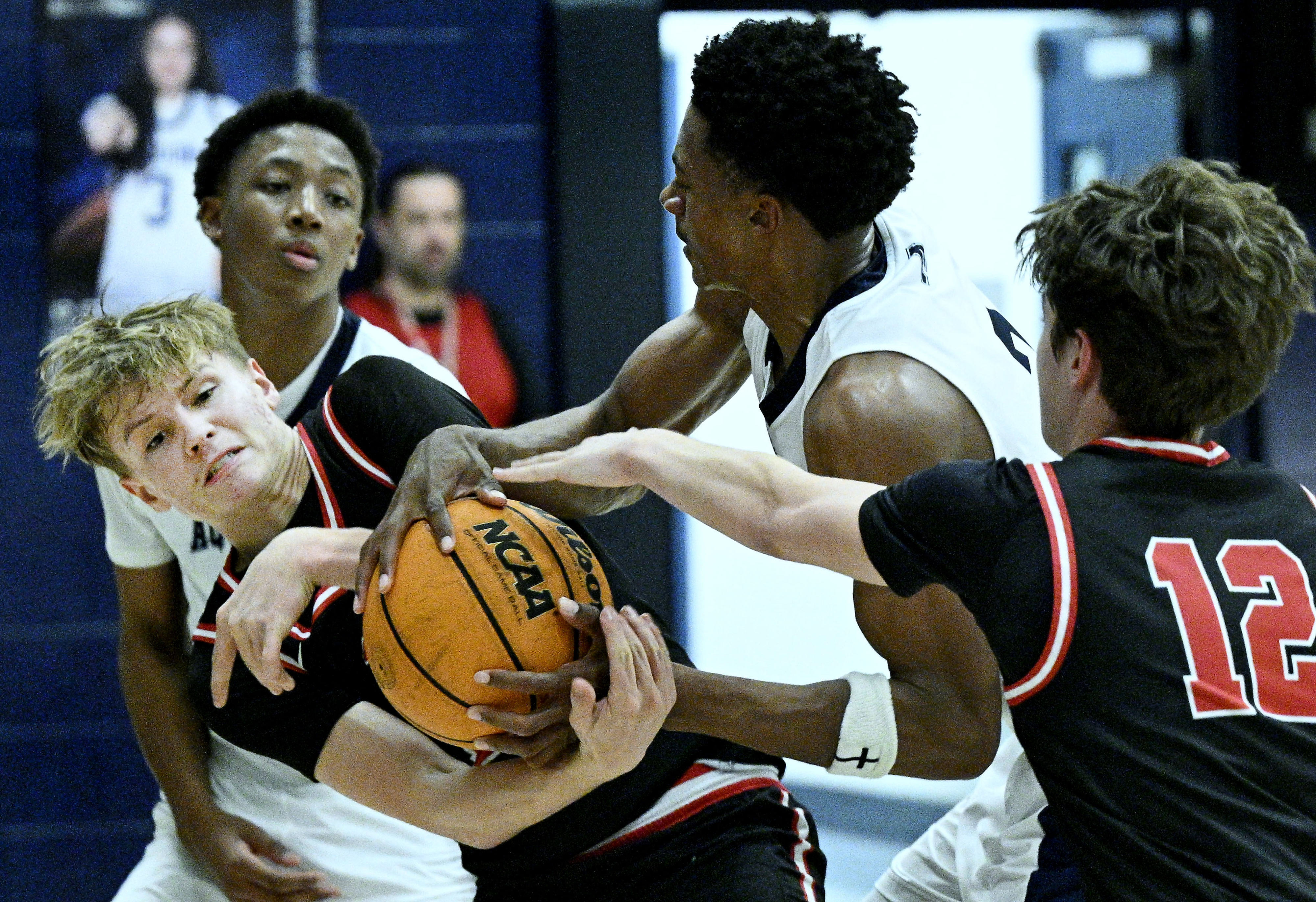 Arrowhead Christian Academy guard Warren Ryan (10) fights for a...