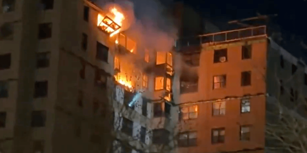 Emergency crews rush to huge blaze engulfing upper floors of high-rise