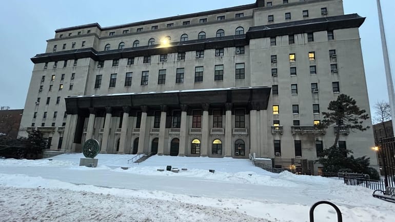 Few people were out early in Jamaica, Queens, Monday.
