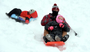 Schools across Connecticut were closed Monday due to the winter storm, which allowed kids to enjoy the snow. Howard Kelly of Bridgeport sleds down a hill at Beardsley Park in Bridgeport with his daughter, Madison, 9, on January 26, 2026 after a foot of snow fell the previous day. Kelly’s son, Jackson, 4, sleds behind them.