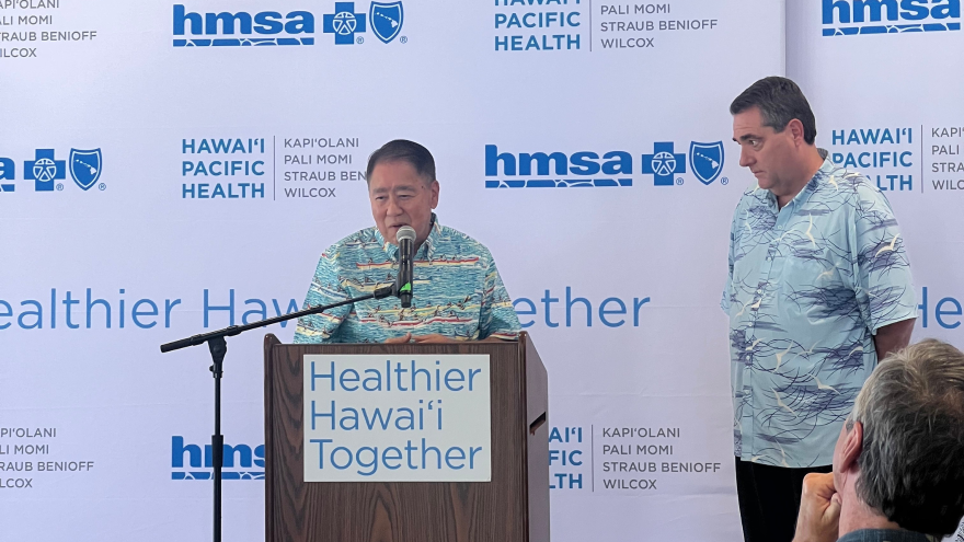 HMSA President & CEO Dr. Mark Mugiishi, left, and Hawaiʻi Pacific Health President & CEO Ray Vara at a news conference Wednesday, Jan. 7, at the Harry and Jeanette Weinberg Hoʻokupu Center.