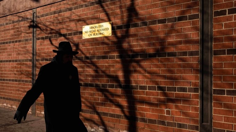 A person walks past the Chabad Lubavitch world headquarters, Thursday,...