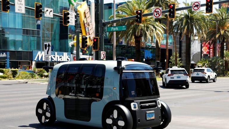 An Amazon Zoox driverless robotaxi driving on the Las Vegas...