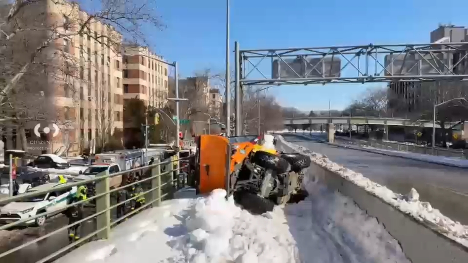 Snow plow flips over in Brooklyn
