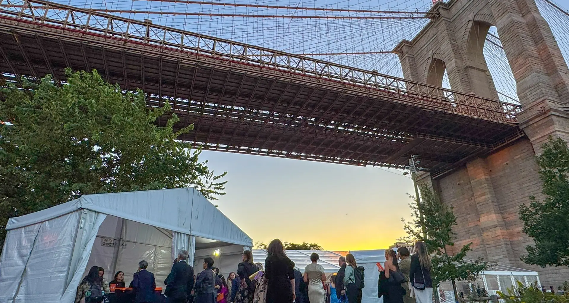 Guests arrive at the Emily Warren Roebling Plaza at dusk for the Brooklyn Bridge Park annual gala on Wednesday, Oct. 8, 2025. Photo by Beth Eisgrau-Heller