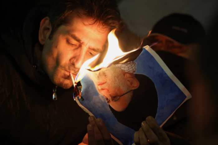 a man burning a photo
