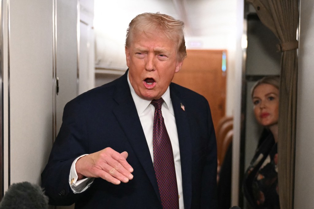 Donald Trump speaking to the press aboard Air Force One.