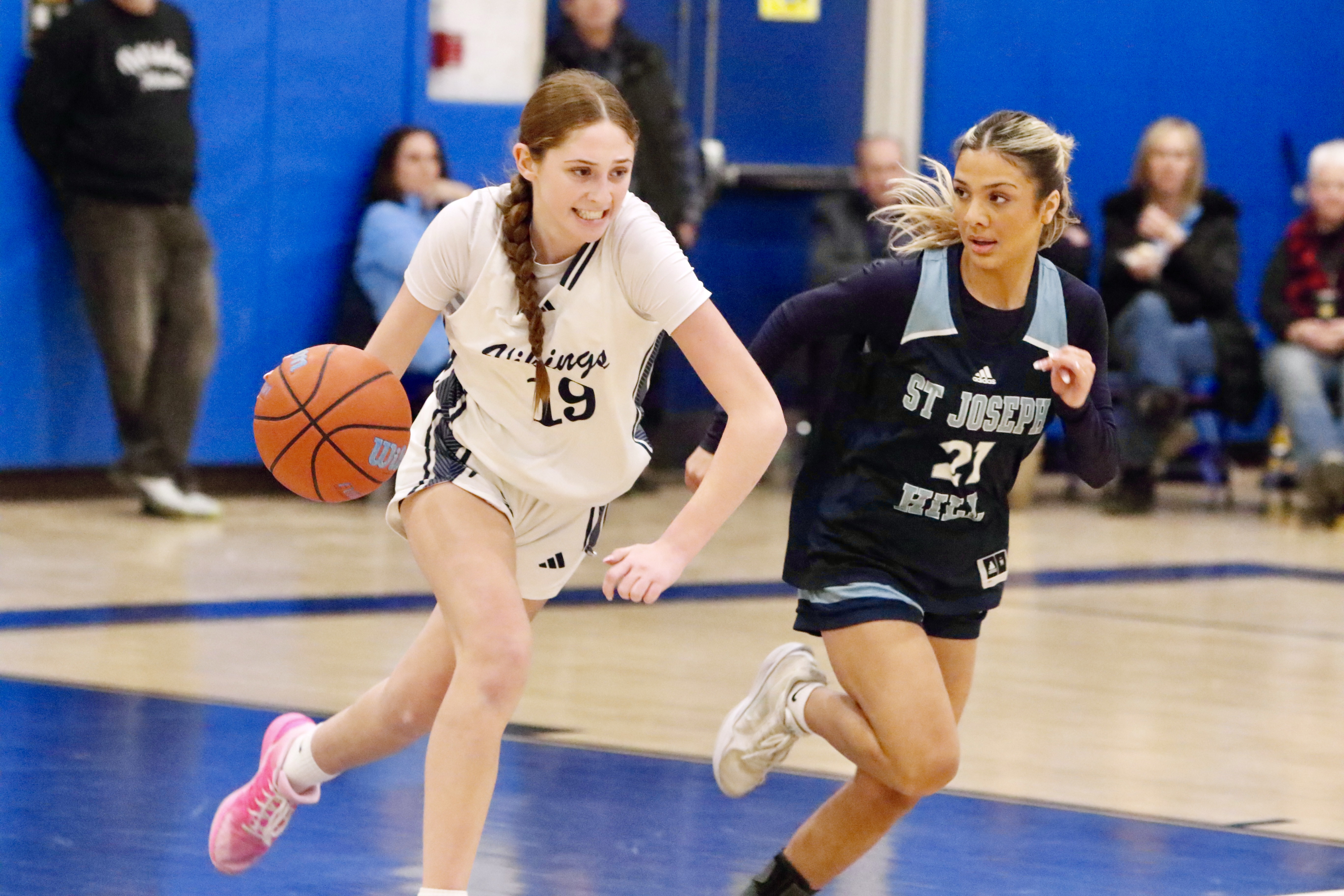 St. Joseph by the Sea's Isabella Castania looks to get past her defender during a Borough President's Cup quarterfinal meeting vs. St. Joseph Hill on Jan. 27, 2025.