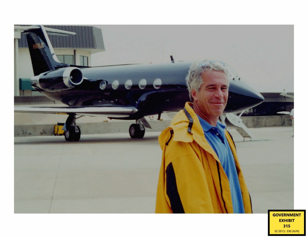 Jeffrey Epstein standing in front of a private jet.