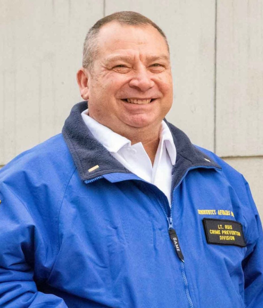 YPD Lieutenant John Ruis in a blue jacket.