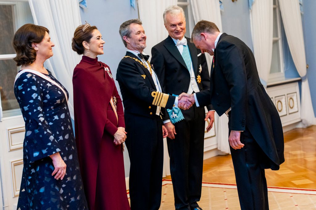 Queen Mary and King Frederik greet the Lithuanian president at a state banquet in Vilnius on 28 January 