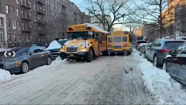 News 12 | Brooklyn | Two school buses collide on narrow Flatbush street lined by snowbanks