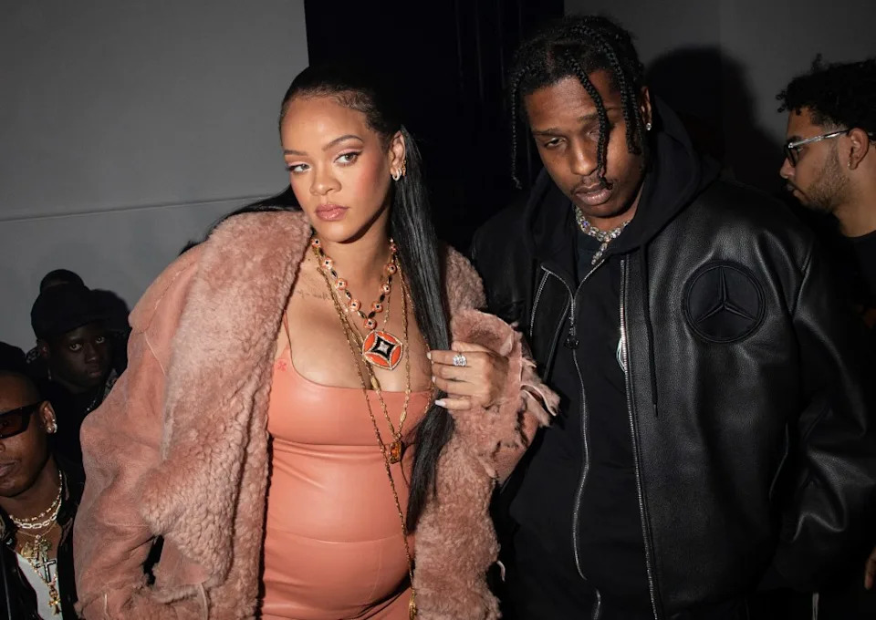 Rihanna and ASAP Rocky appear at an event during Paris Fashion Week in Feb. 2022. (Photo by Vianney Le Caer/Invision/AP, File)