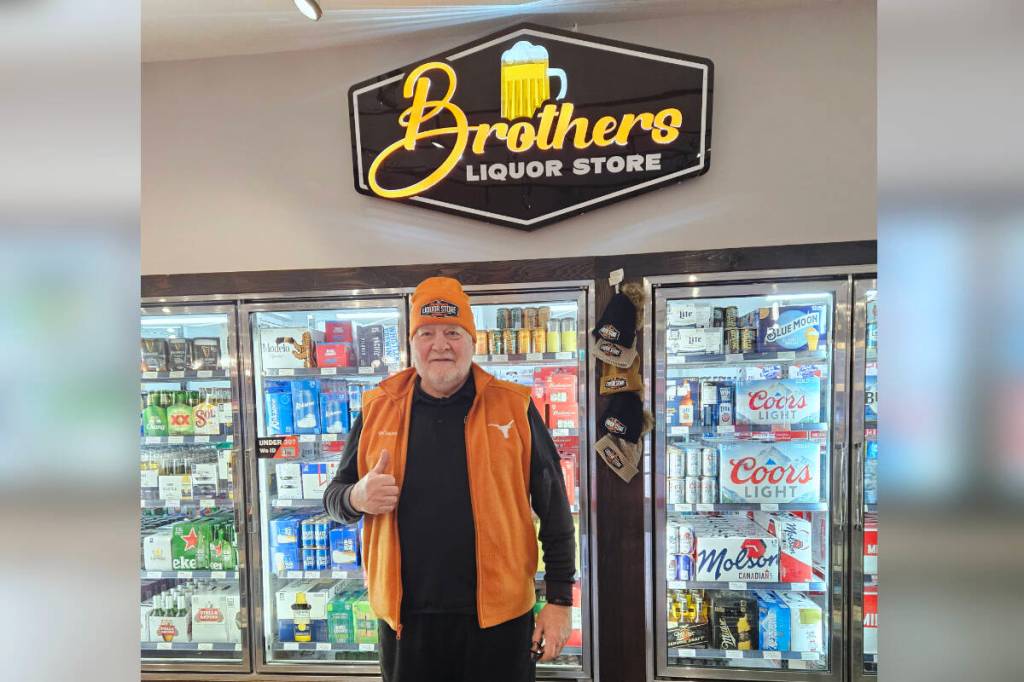 Following an extensive football coaching career, Cam Innes now coaches customers in their beverage choices at Brothers Liquor Store, where &ldquo;they keep me young… we have some fun.&rdquo; (Lynda Innes photo)