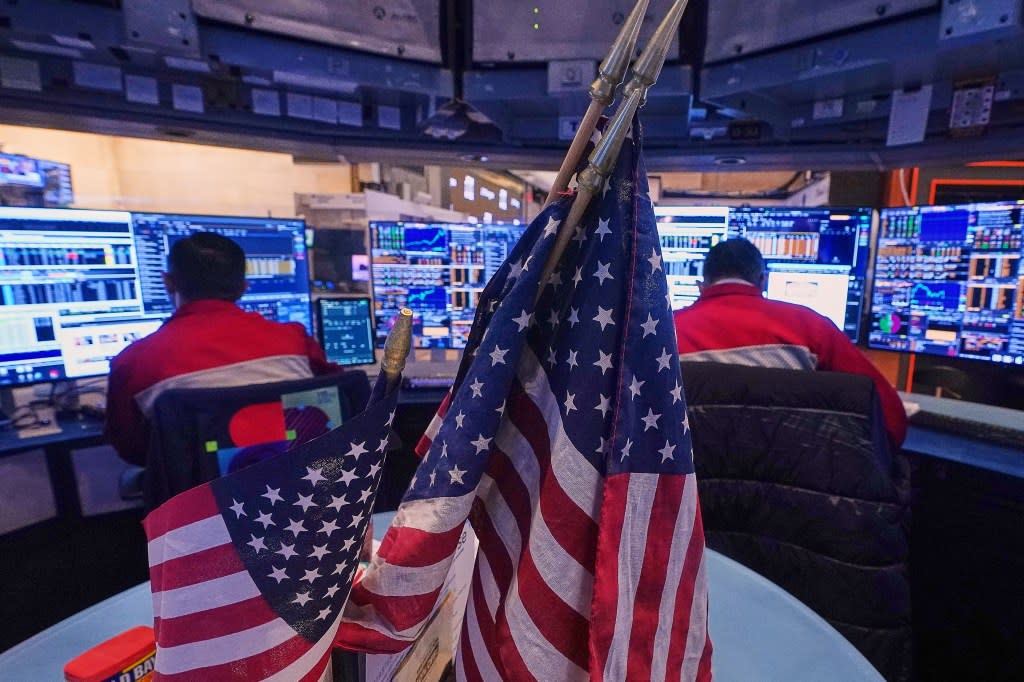 A pair of traders work on the floor of the New York Stock Exchange, Monday, Jan. 12, 2026. AP