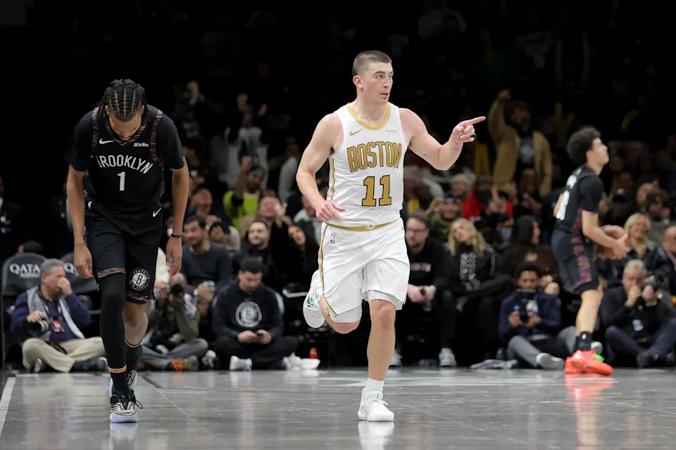 Jan 23, 2026; Brooklyn, New York, USA; Boston Celtics guard Payton Pritchard (11) celebrates his three point shot against Brooklyn Nets forward Ziaire Williams (1) during the first overtime at Barclays Center. Mandatory Credit: Brad Penner-Imagn Images