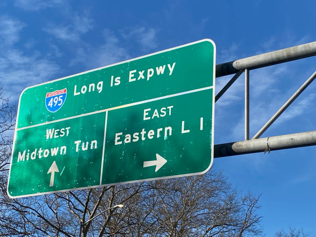 Interstate 495, Long Island Expressway, LIE, road sign with directions to New York City or Long Island. 