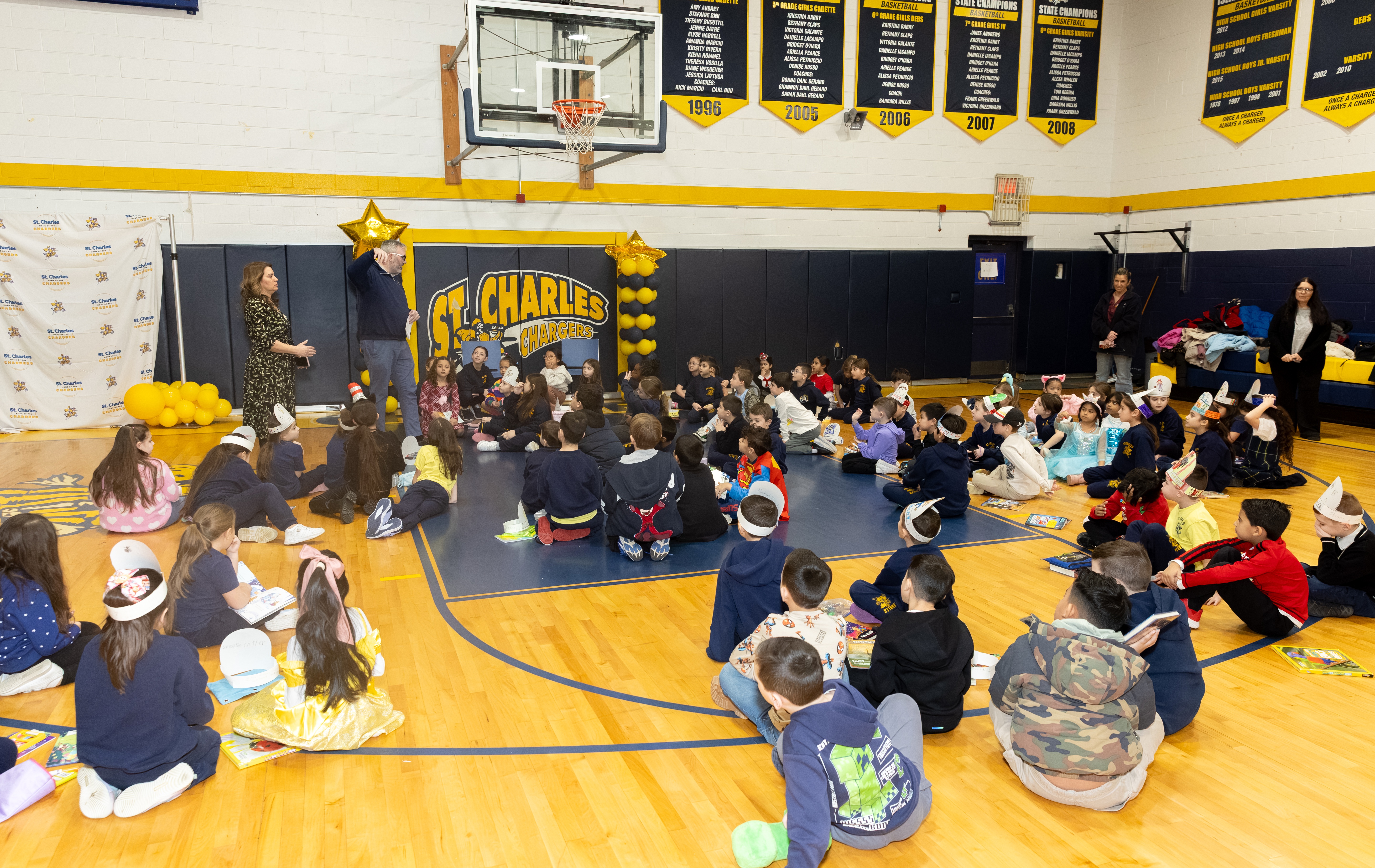 Borough President Vito Fossella and Jann Amato, regional superintendent of the Catholic School Region of Staten Island, celebrate literacy day with first and second graders as part of Catholic Schools Week at the St. Charles School in Oakwood on Wednesday, Jan. 28, 2026 (Advance/SILive.com | Jason Paderon)