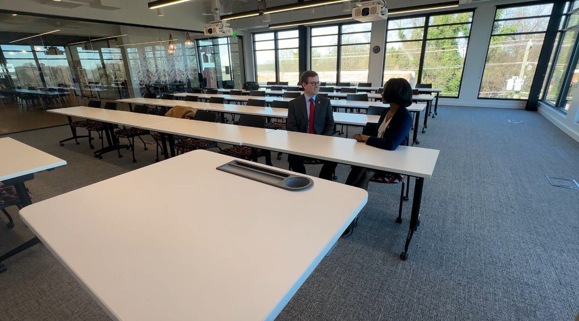 Jack Randolph and Kayla Price are enrolled in Elon University's Law Flex Program in Charlotte. The paralegals said they're excited the institution is expanding to a full-time option for students in a growing area. (Spectrum News 1/Jennifer Roberts)