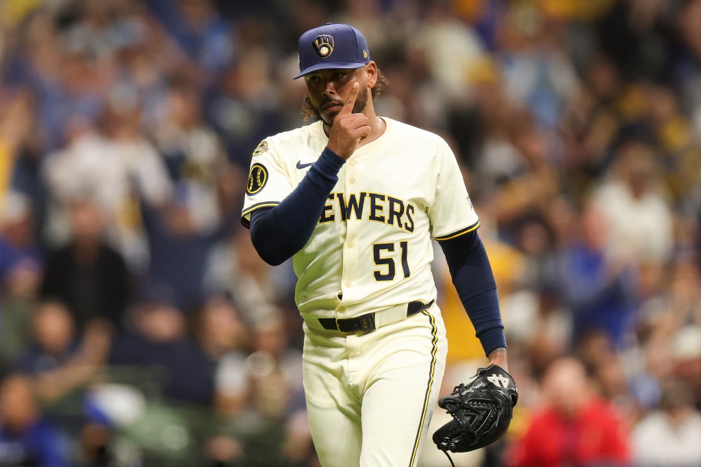 Freddy Peralta #51 of the Milwaukee Brewers celebrates during the fifth inning.