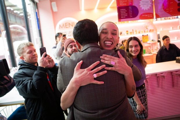 Mayor Zohran Mamdani gets a hug at Sweets and Things in Brooklyn on Wednesday, Jan. 14, 2026, after signing Executive Order 11 to create an inventory and identify ways to cut the fees and fines that small businesses pay in New York City. (Ed Reed / Mayoral Photography Office)
