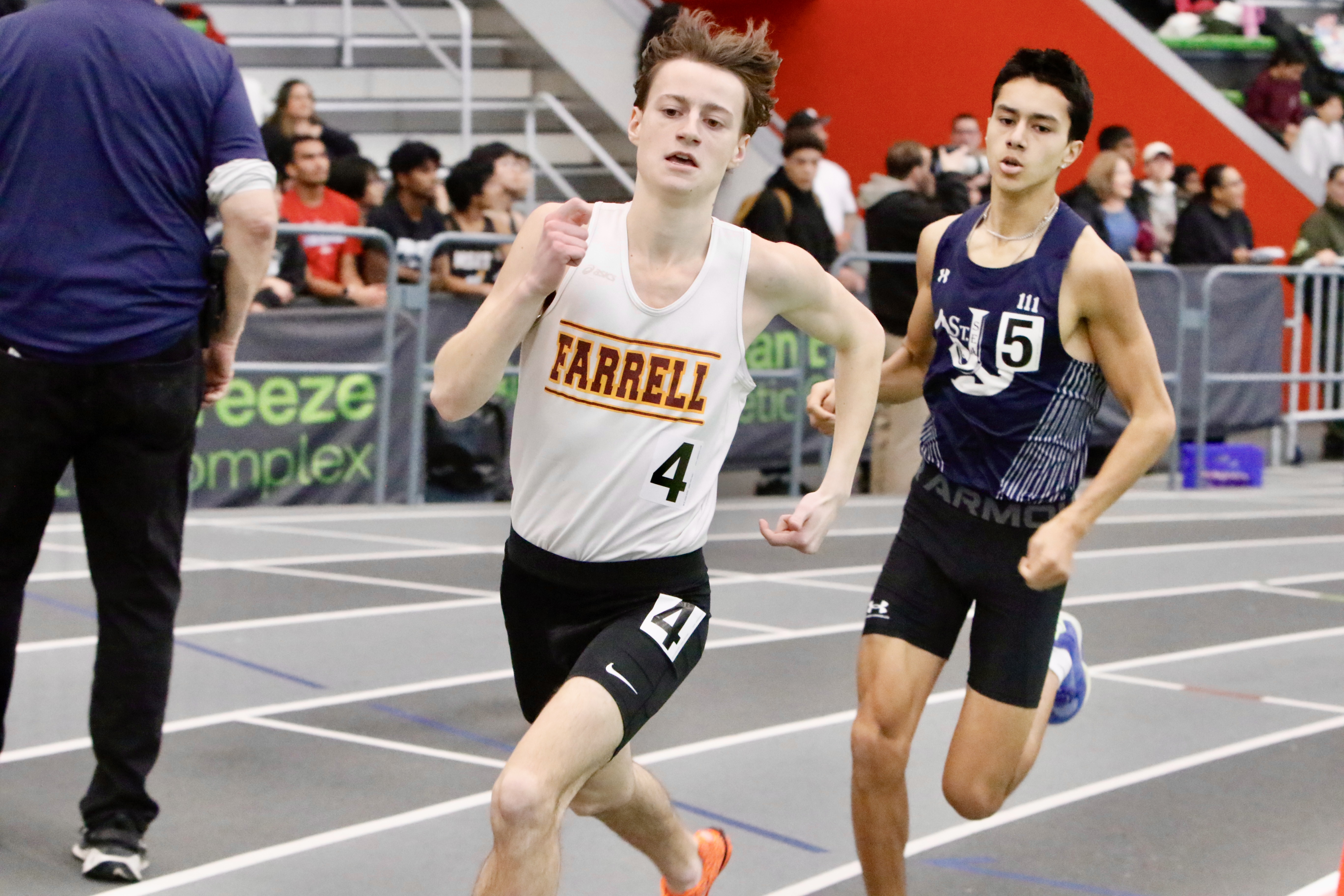 1000 meter runner-up Matthew Venditti of Monsignor Farrell and champion Adam Vitale of Sea battle it out at the Staten Island High School Indoor Track and Field Championship on Jan. 18, 2026.