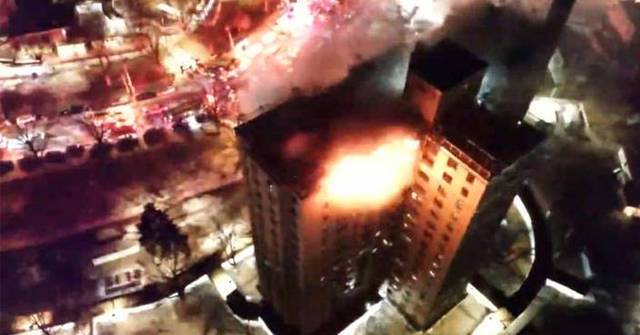 Firefighters battle blaze on top floors of Bronx apartment