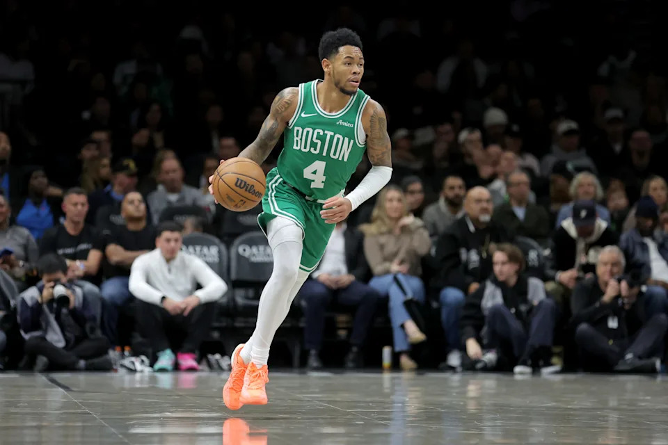 Nov 18, 2025; Brooklyn, New York, USA; Boston Celtics guard Anfernee Simons (4) brings the ball up court against the Brooklyn Nets during the second quarter at Barclays Center. Mandatory Credit: Brad Penner-Imagn Images