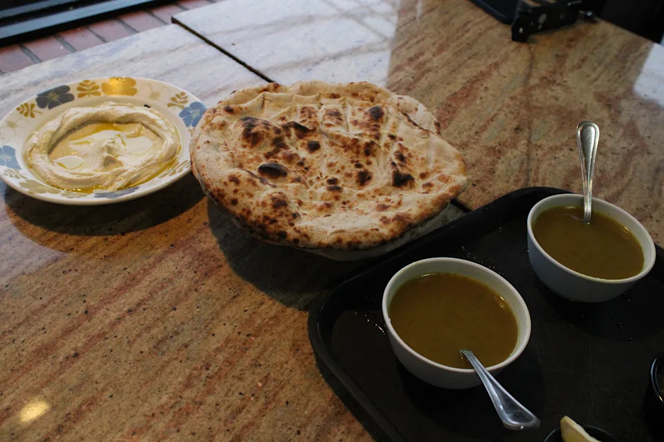 Hummus, soup, and Yemeni malawah bread