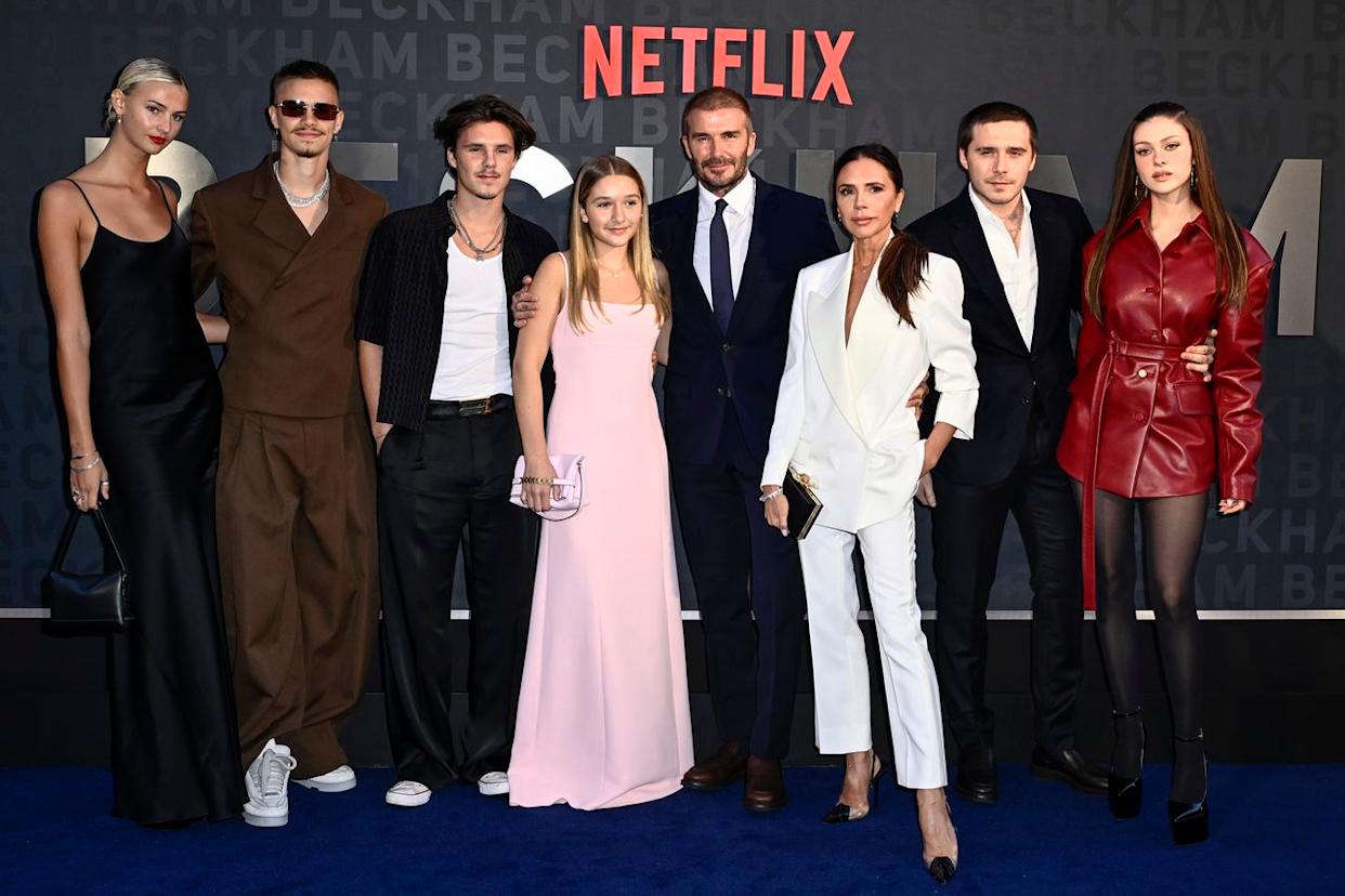 Gareth Cattermole/Getty  Mia Regan, Romeo Beckham, Cruz Beckham, Harper Beckham, David Beckham, Victoria Beckham, Brooklyn Peltz Beckham and Nicola Peltz Beckham attend the Netflix 'Beckham' UK Premiere in 2023.
