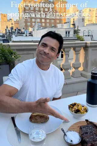 Mark Consuelos and Kelly Ripa enjoying dinner on their roof Kelly Ripa/Instagram