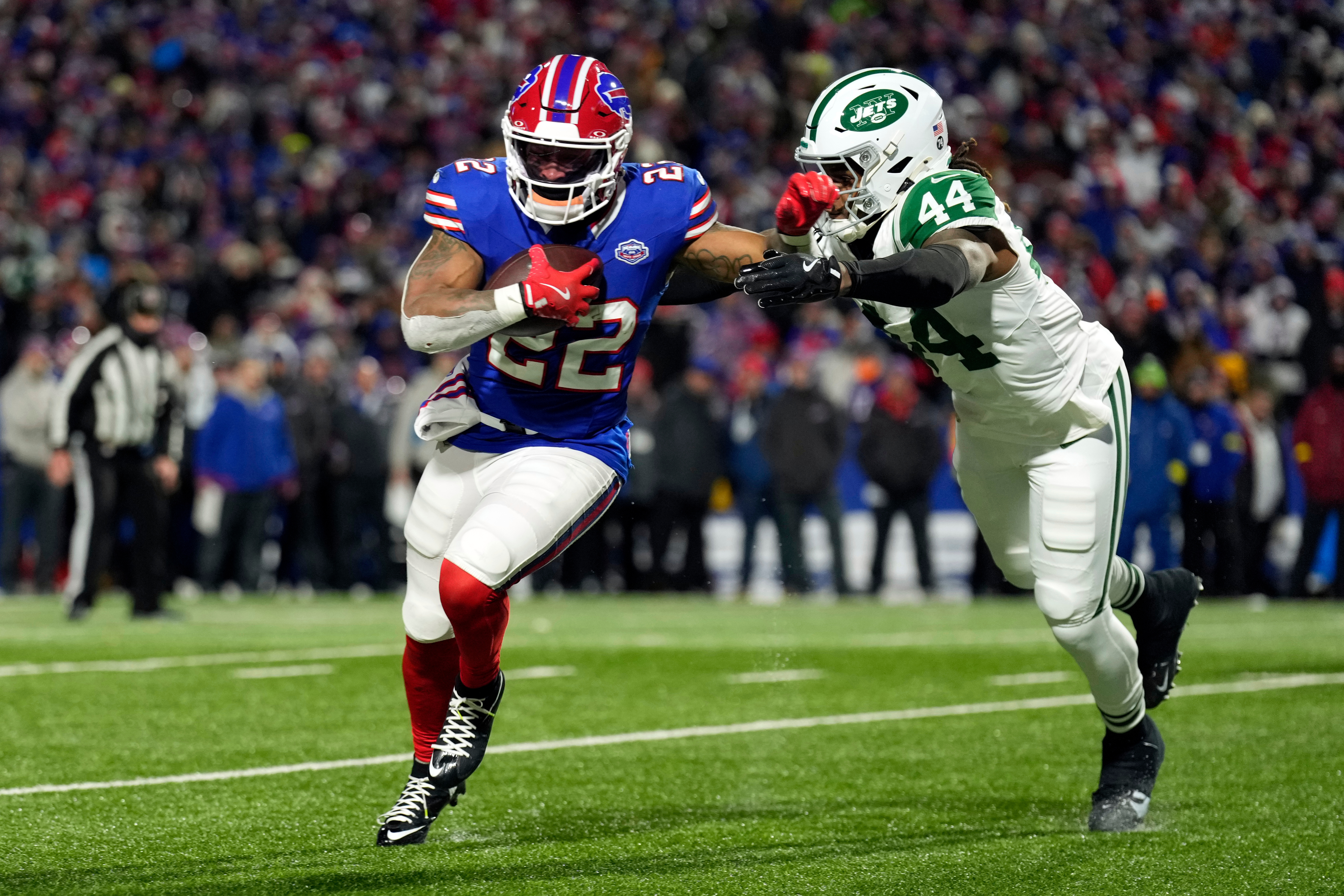 Buffalo Bills running back Ray Davis (22) gets past New York Jets linebacker Jamien Sherwood (44) as Davis scores a touchdown in the first half of an NFL football game Sunday, Jan. 4, 2026, in Orchard Park, N.Y. (AP Photo/Seth Wenig)
