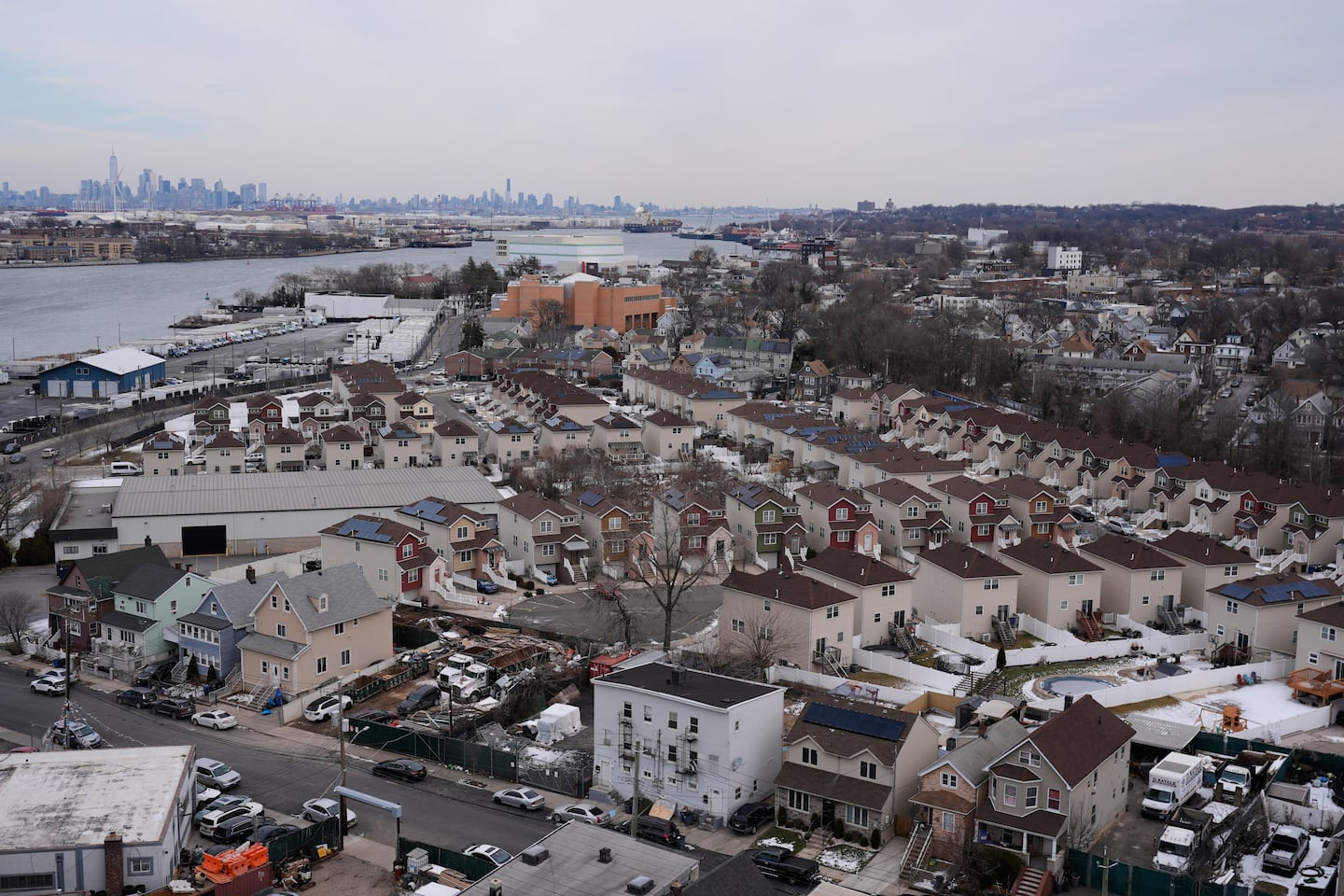 The skyline of lower Manhattan, top left, is seen behind the Staten Island borough of New York, Jan. 23, 2026.