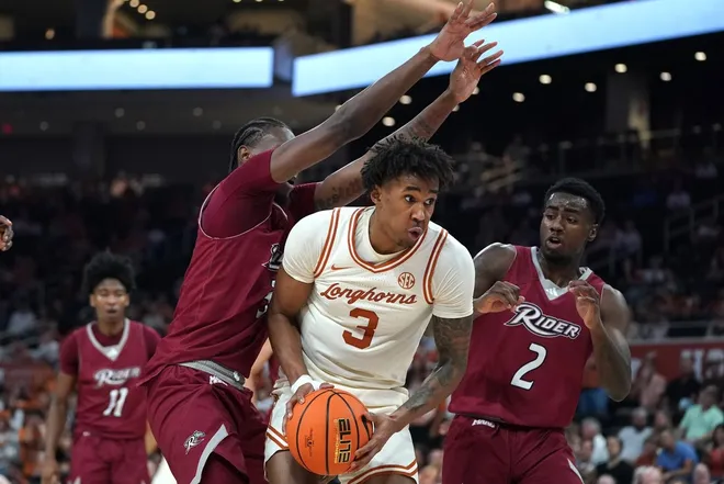 Nov 18, 2025; Austin, Texas, USA; Texas Longhorns guard Dailyn Swain (3) looks to shoot against Rider Broncs forward Shemani Fuller (3) and guard Caleb Smith (2) during the first half at Moody Center.