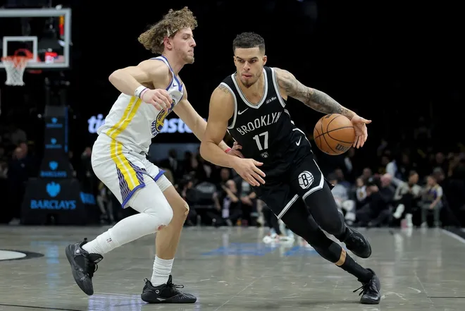 Dec 29, 2025; Brooklyn, New York, USA; Brooklyn Nets forward Michael Porter Jr. (17) drives to the basket against Golden State Warriors guard Brandin Podziemski (2) during the third quarter at Barclays Center.