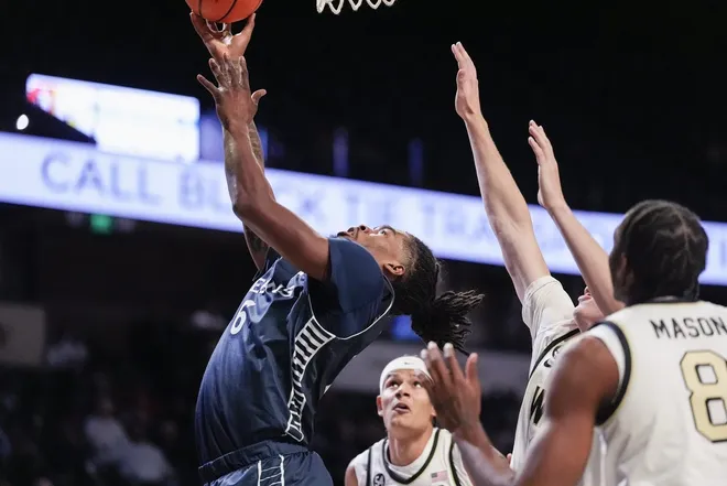 Dec 14, 2025; Winston-Salem, North Carolina, USA; Queens University Royals forward Avantae Parker (6) shoots the ball against the Wake Forest Demon Deacons during the second half at Lawrence Joel Veterans Memorial Coliseum.